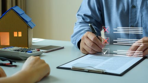 Man checking off items from a list: Executor of a will following a probate checklist. Checking off what he needs to do, when he needs to do it and what he will need. Legal blog from an Estate and Probate Attorney.