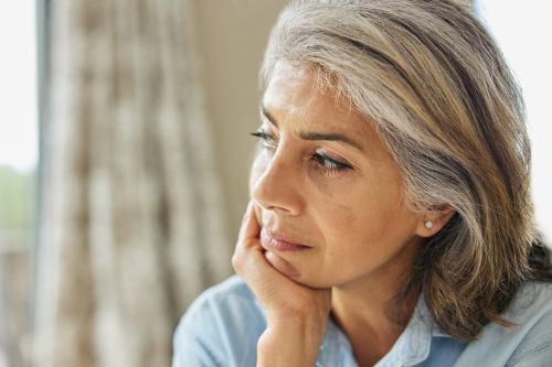 A thoughtful mature woman. Visual concept for a estate planning blog discussing planning for incapacity and health decisions.