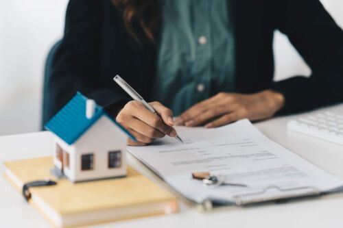 Attorney reviewing paperwork for a client who's parent died intestate. Visual concept for a blog discussing the impact of dying intestate and how a will can simplify asset distribution in Nevada.