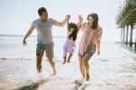 Young family walks along the sand - Estate planning for young adults concept